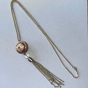 Gold toned statement lariat tassel necklace with burgundy stones